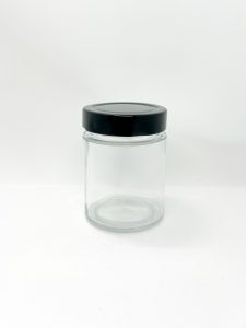 round glass jar with black lug cap